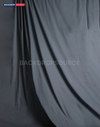 Grey photography muslin background featuring a seamless, professional studio setup for modern portrait shoots.