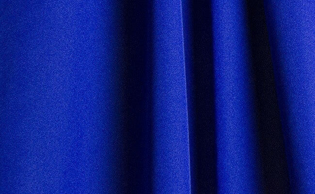 Cobalt blue wrinkle-resistant fabric featuring a smooth, wrinkle-resistant background, ideal for professional designs.