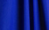 Cobalt blue wrinkle-resistant fabric featuring a smooth, wrinkle-resistant background, ideal for professional designs.