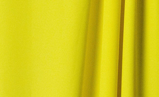 Lemon wrinkle-resistant background showing vibrant lemons on a smooth, durable surface for modern design needs.