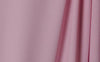 Passion Pink wrinkle-resistant background featuring smooth, vibrant pink fabric ideal for professional photography.